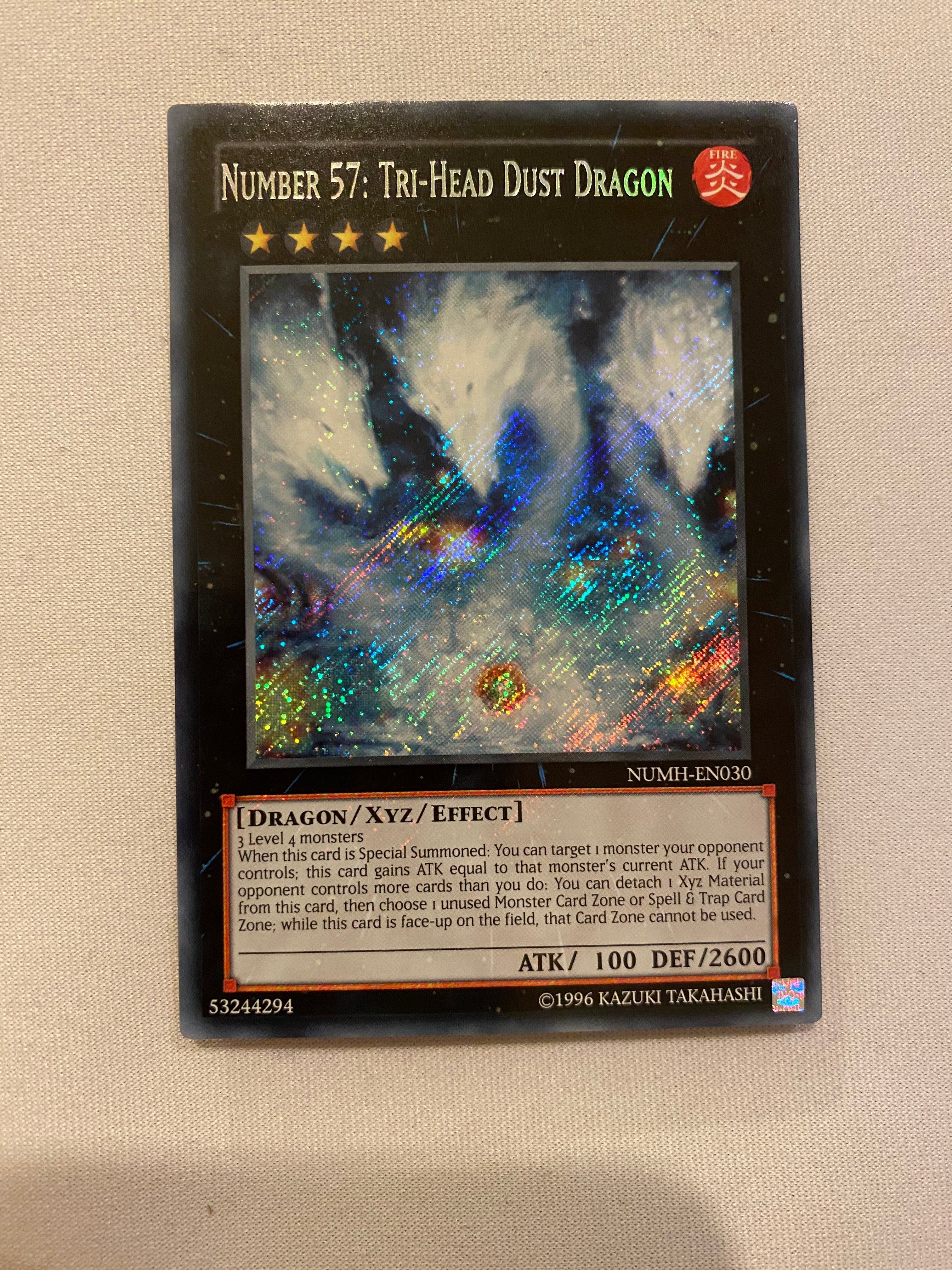 Yugioh Number 57: Tri-Head Dust Dragon NUMH-EN030 Secret Rare Unlimite