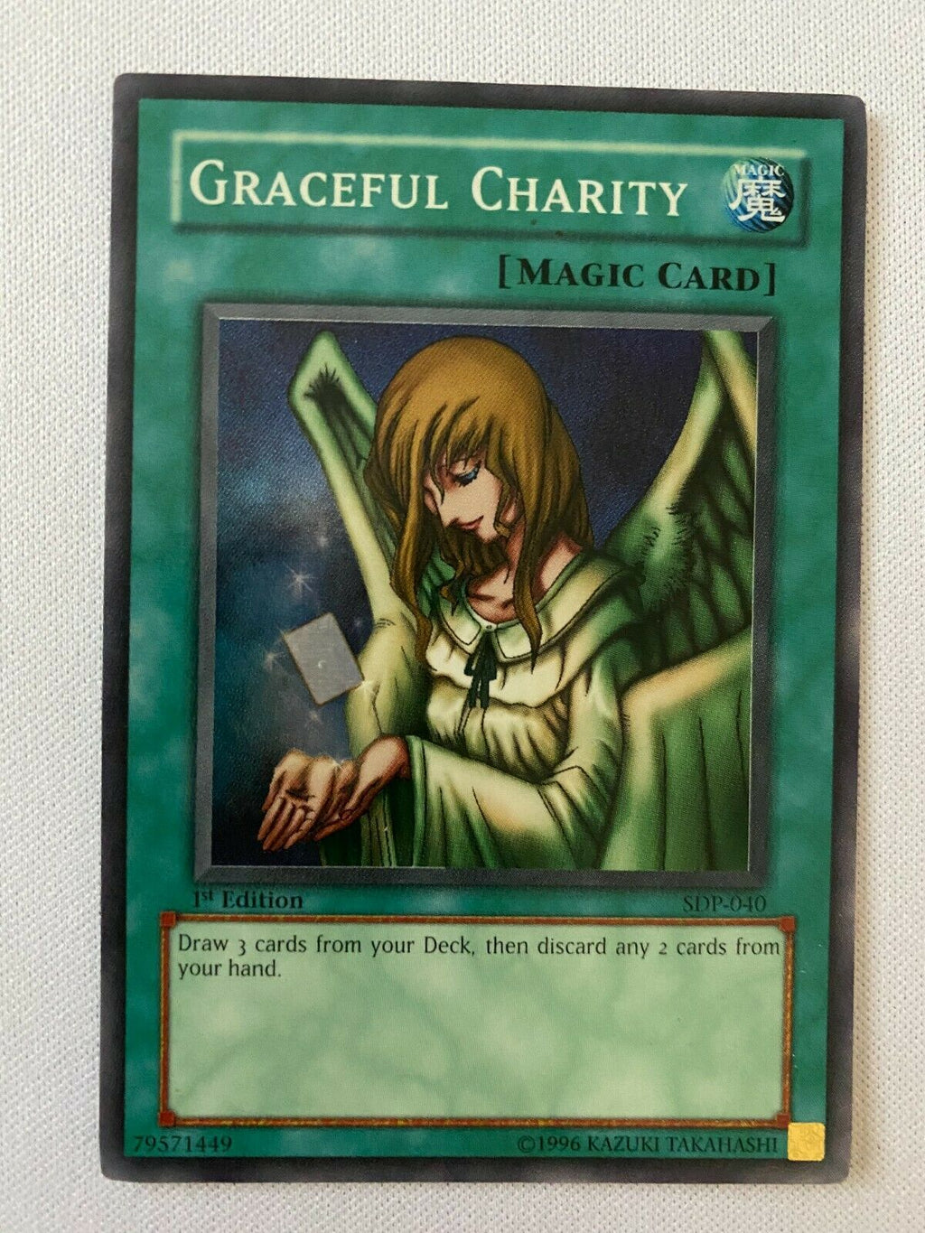 graceful charity yugioh card then discard 2 cards. Why is Graceful Charity Banned