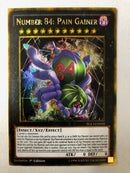 Yugioh Number 84: Pain Gainer PGL3-EN010 Gold Secret 1st Edition NM