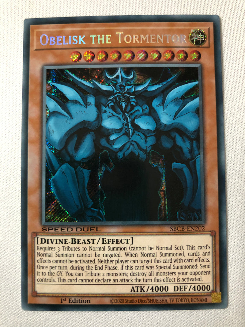 Yugioh Obelisk The Tormentor SBCB-EN202 Secret Rare 1st Edition Near Mint